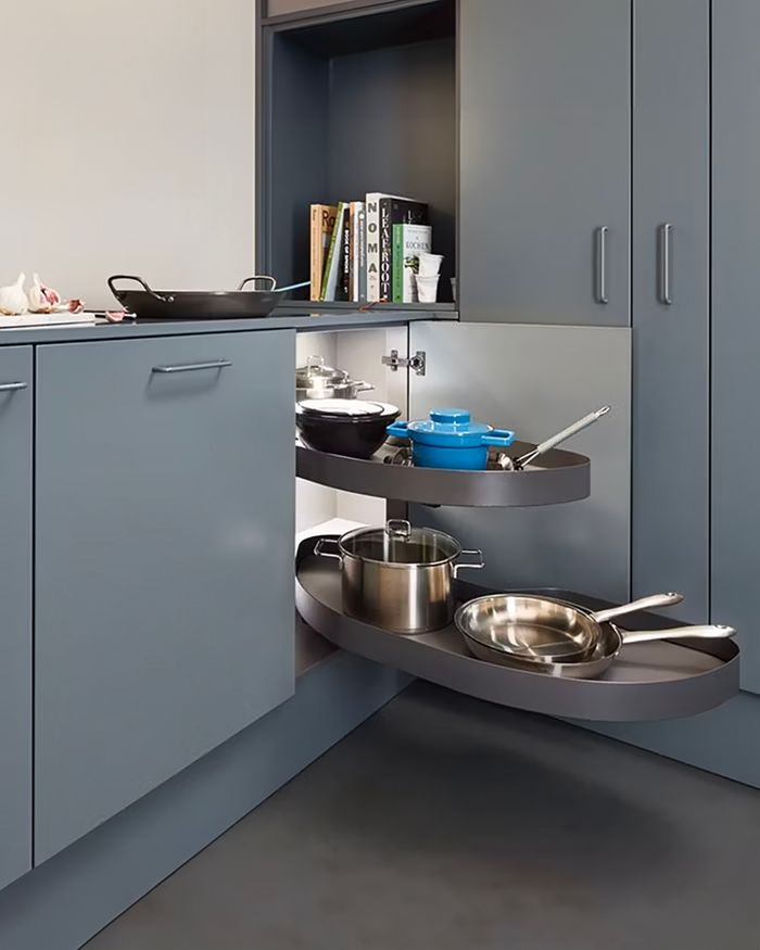 Image captures the architectural innovation of the Cornerstone system by Vauth-Sagel in kitchen storage, with a modern design that allows for the rational exploitation of corners.