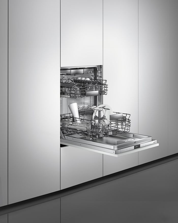 Detail of the open interior of the Mebel Arts dishwasher, ideal for modern kitchens.