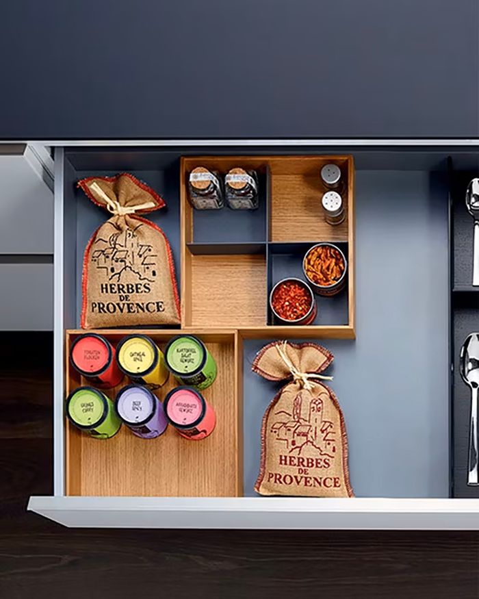 Mebel Arts spice storage composition with Kessebohmer's MosaiQ for smart kitchen organization.