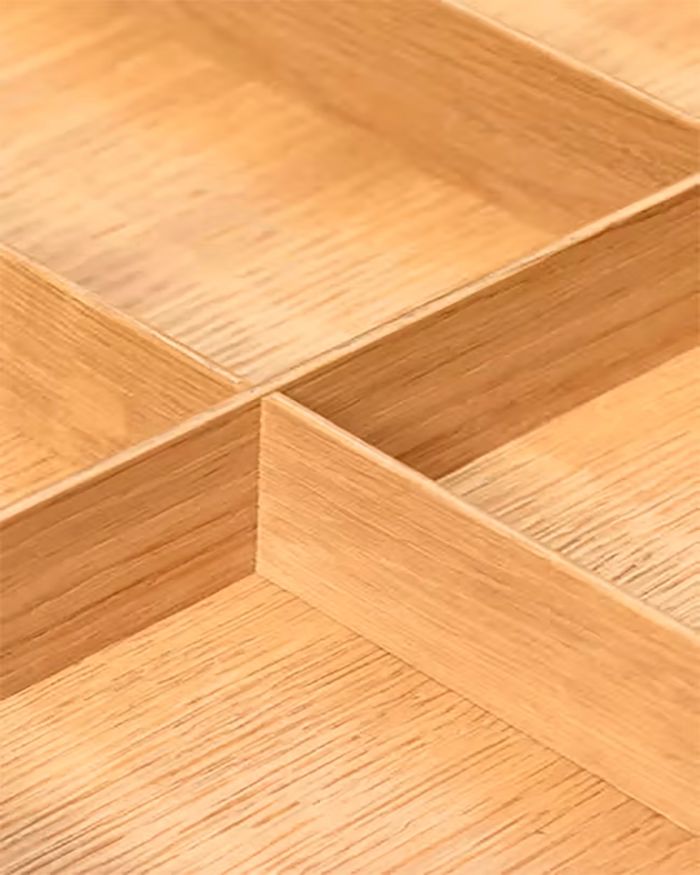 Close-up of Kessebohmer's MosaiQ wooden dividers from Mebel Arts, adding sophistication to organization.