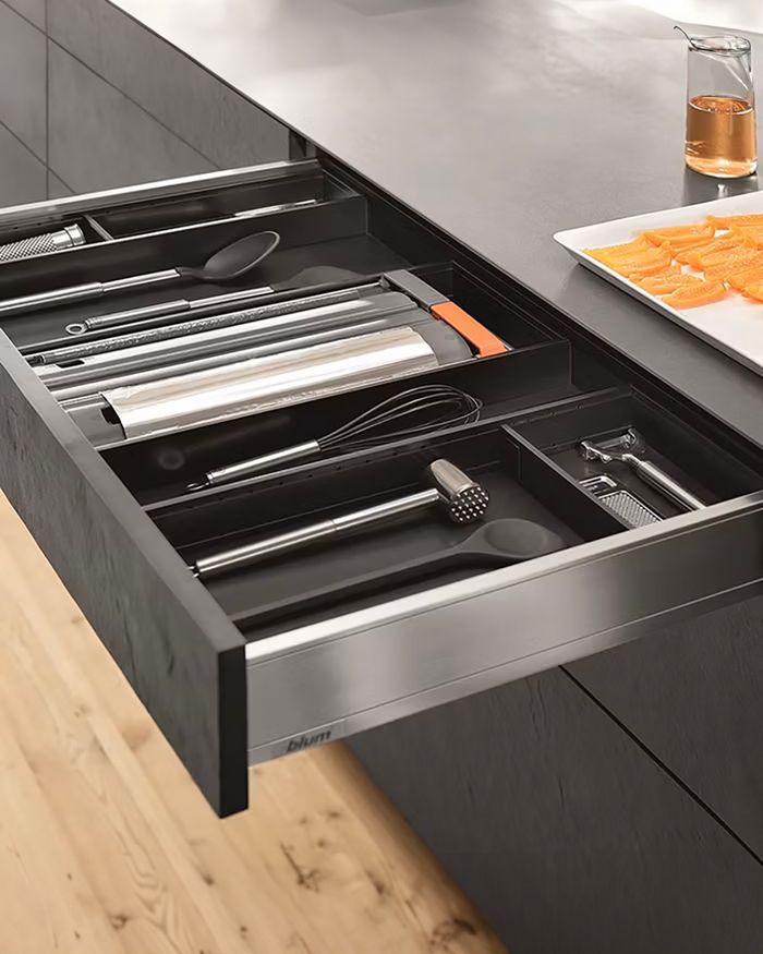 Kitchen equipment in a BLUM Ambia Line drawer, Mebel Arts arrangement.