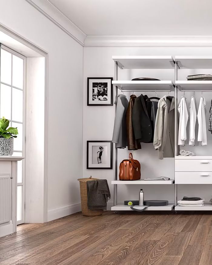 Attractive wardrobe by Mebel-Arts with functional shelves and an elegant white finish.