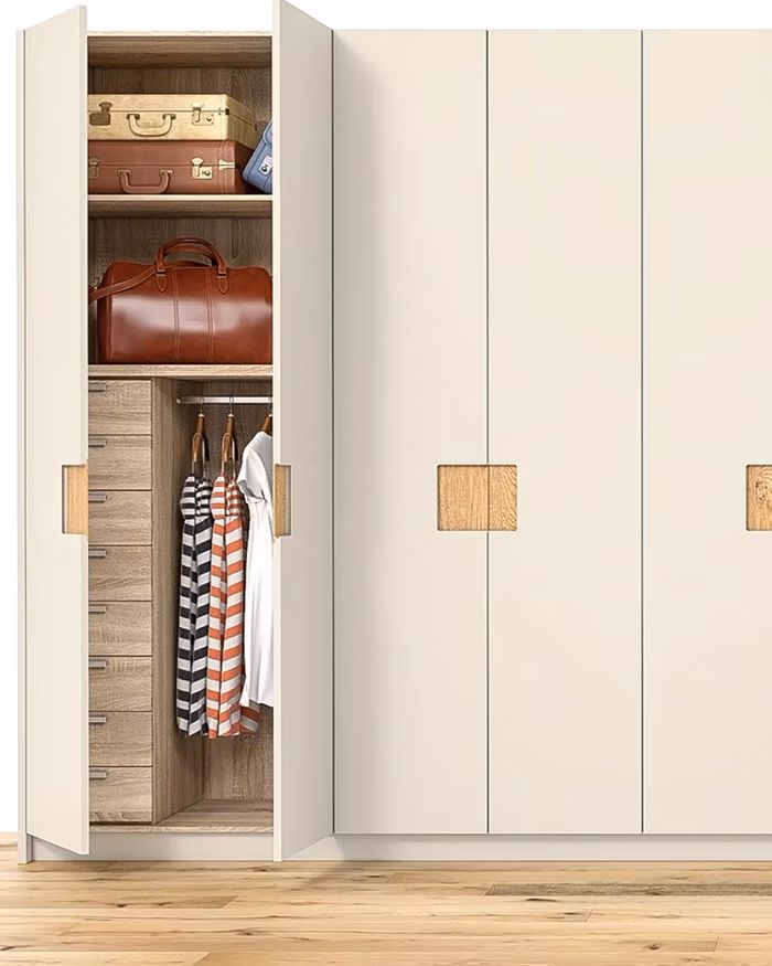 Open bedroom wardrobe Shineo by Mebel Arts with organized accessories and clothes.