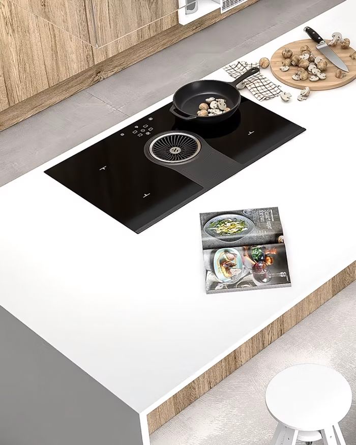 Elegant Mebel Arts Tamo kitchen island with integrated Elica cooktop.