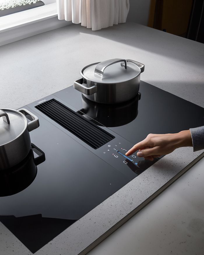 BORA Classic hob with touch function in a contemporary Mebel Arts kitchen, a result of elegance and technology.