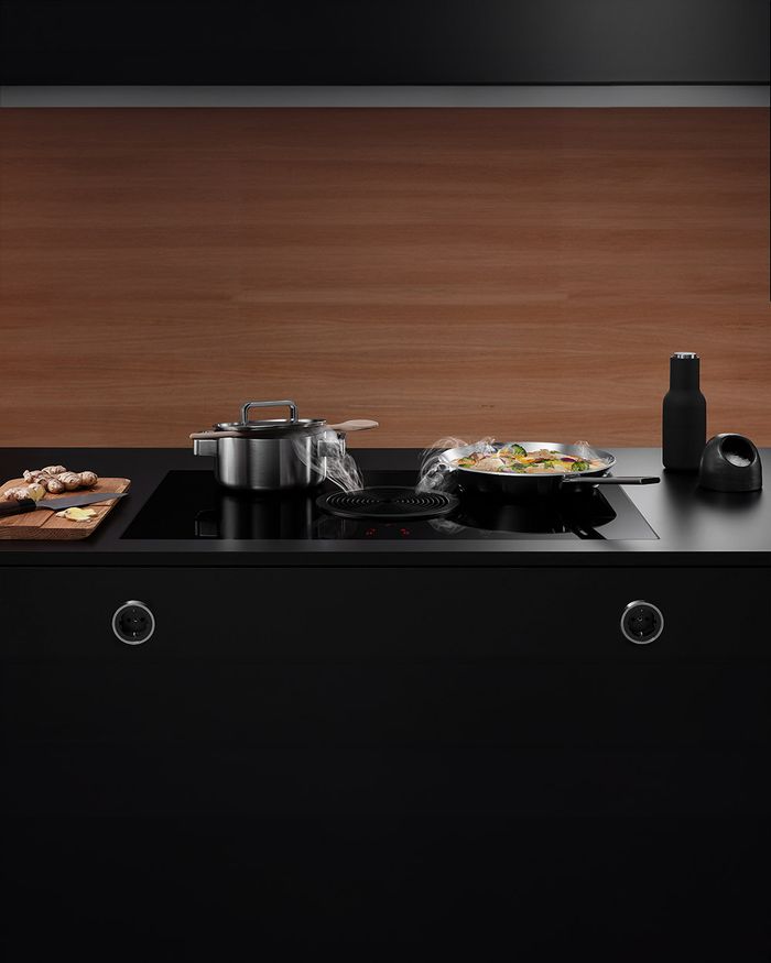 Professional cooking with the BORA X PURE cooktop in the luxurious Mebel Arts kitchen.