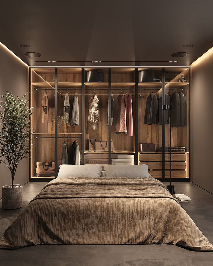 Moonwood Mebel Arts wardrobes with glass doors and organized storage space in the bedroom.