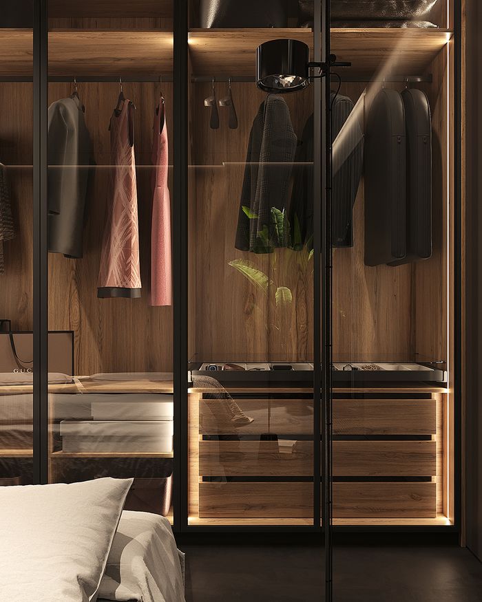 Modern Moonwood wardrobes by Mebel Arts with chest of drawers and hidden LED lighting.