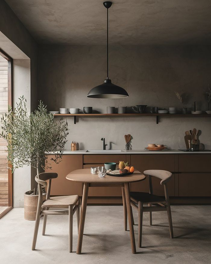 Contemporary Greek kitchen furniture and dining table made of wood, creating a warm and welcoming atmosphere.