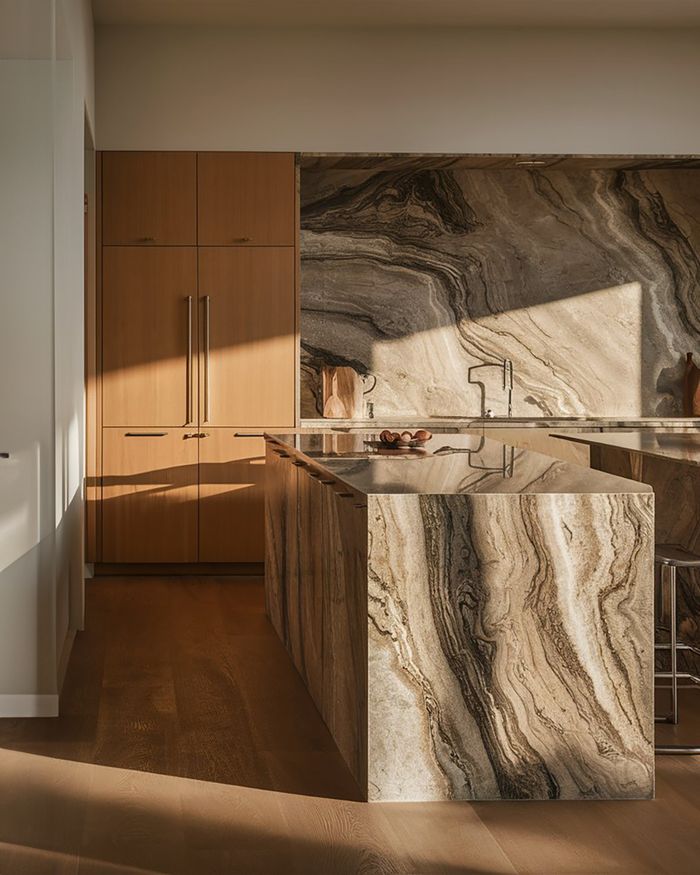 A kitchen with natural wooden furniture, stone walls, and wooden beams on the ceiling. An open space that provides natural lighting and a warm atmosphere.