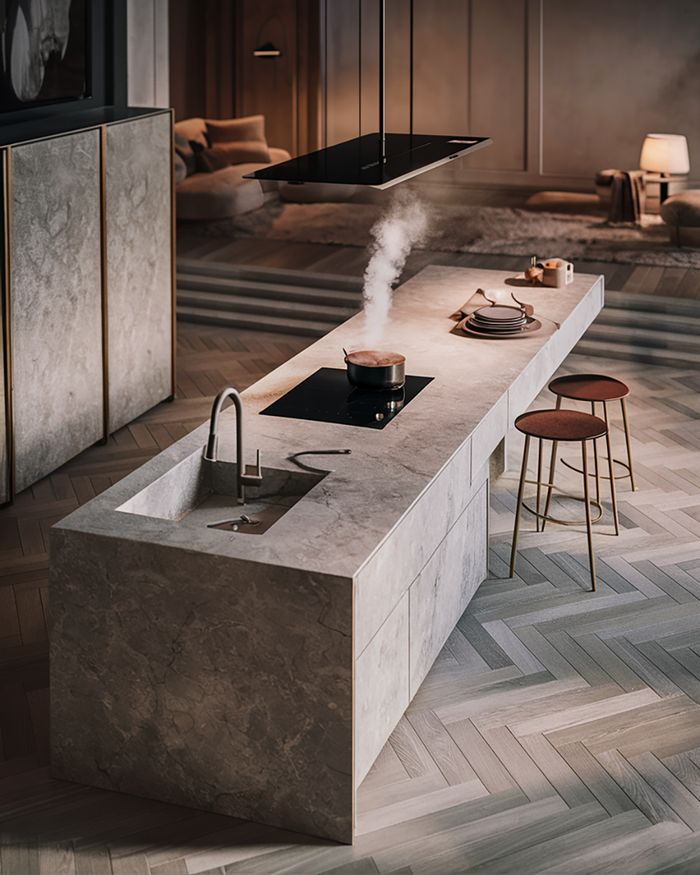 Kitchen furniture in Athens with a modern island made of stone and an integrated cooktop. Elegant design with a minimalist aesthetic and luxurious materials by Mebel Arts.