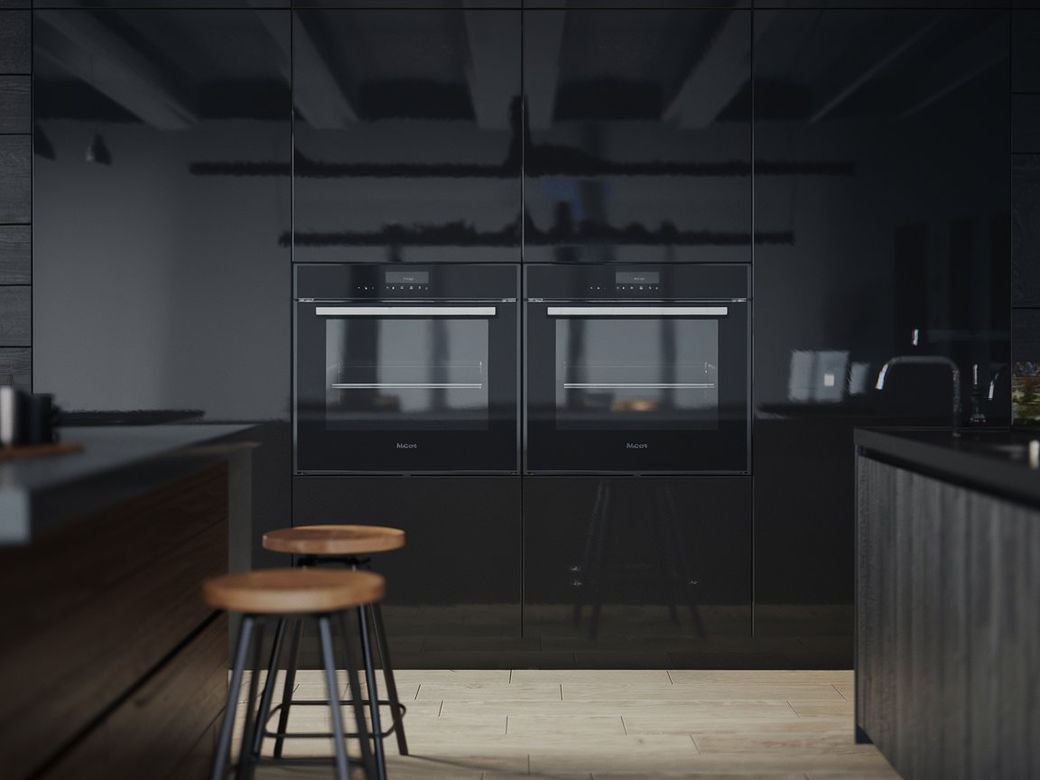 Built-in black ovens in a modern kitchen with wooden stools and glossy finishes on the surfaces.