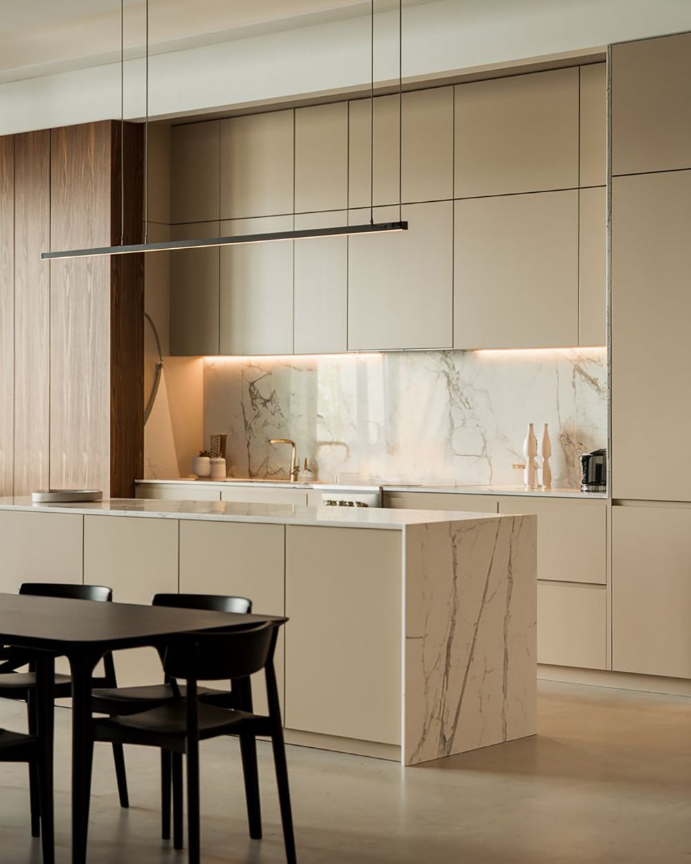 Modern Beige Latte kitchen with a marble island and wooden cladding, featuring a minimal design.