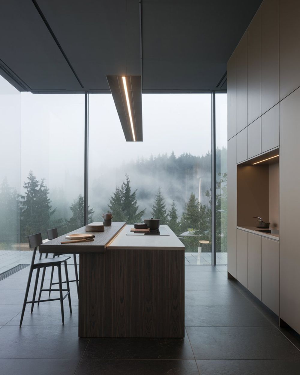 Beige Latte kitchen with a wooden island, linear lighting, and panoramic forest views.