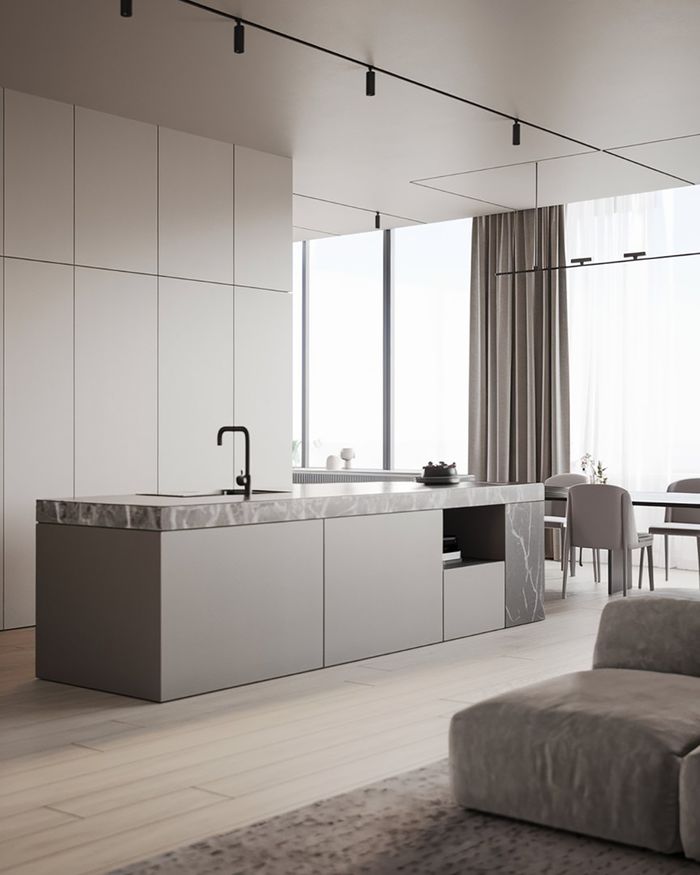 Modern Beige Latte kitchen with a grey marble island, minimal design, and an open layout toward the living room.